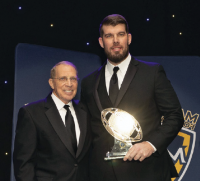 Image of Head Football Coach Tom Perkovich honored at at the 86th Maxwell Football Club National Awards Gala.